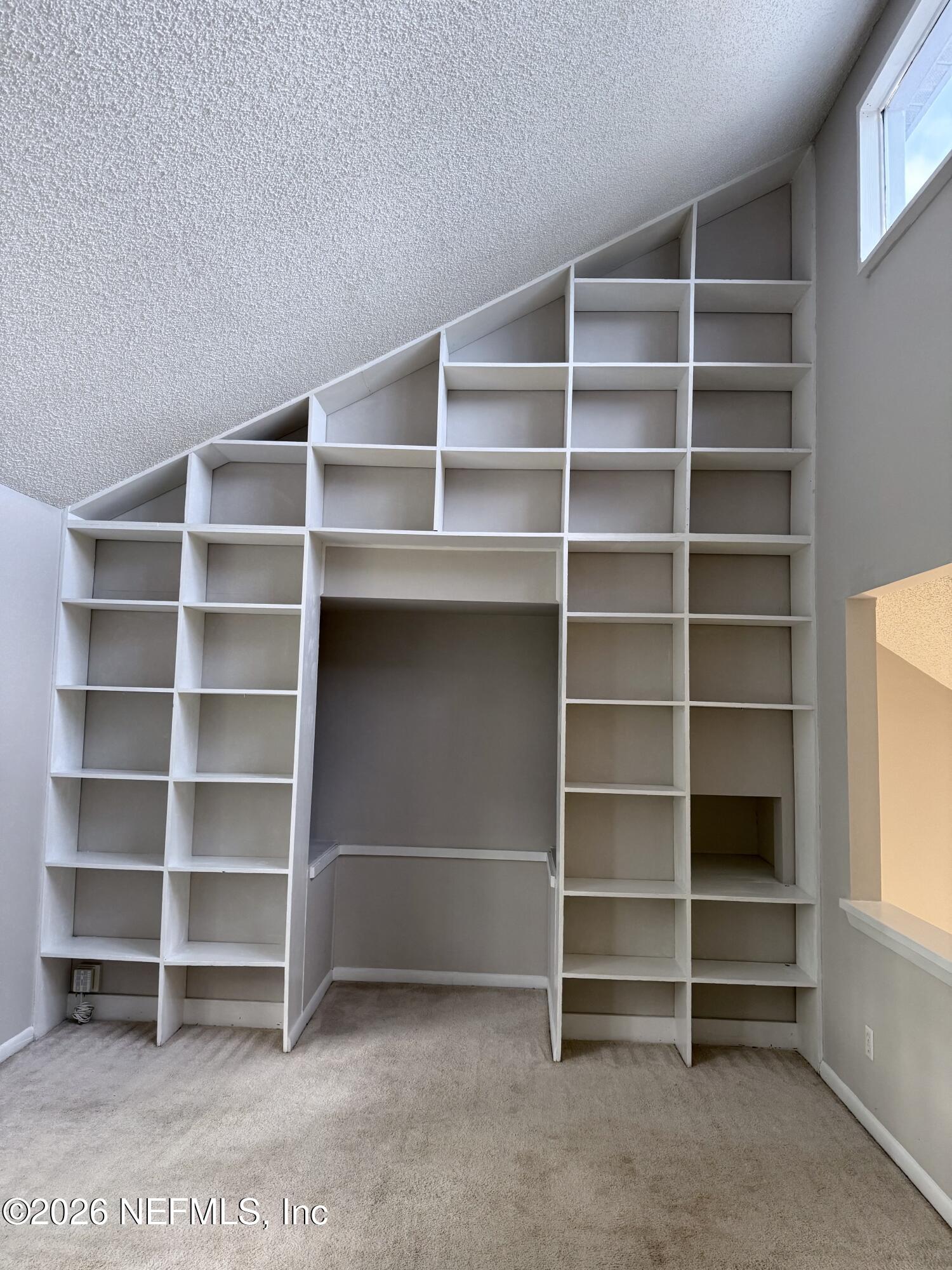 11598 West Ride Drive Jacksonville, FL 32223 - Photo 8 of 15 a view of room with empty empty shelves