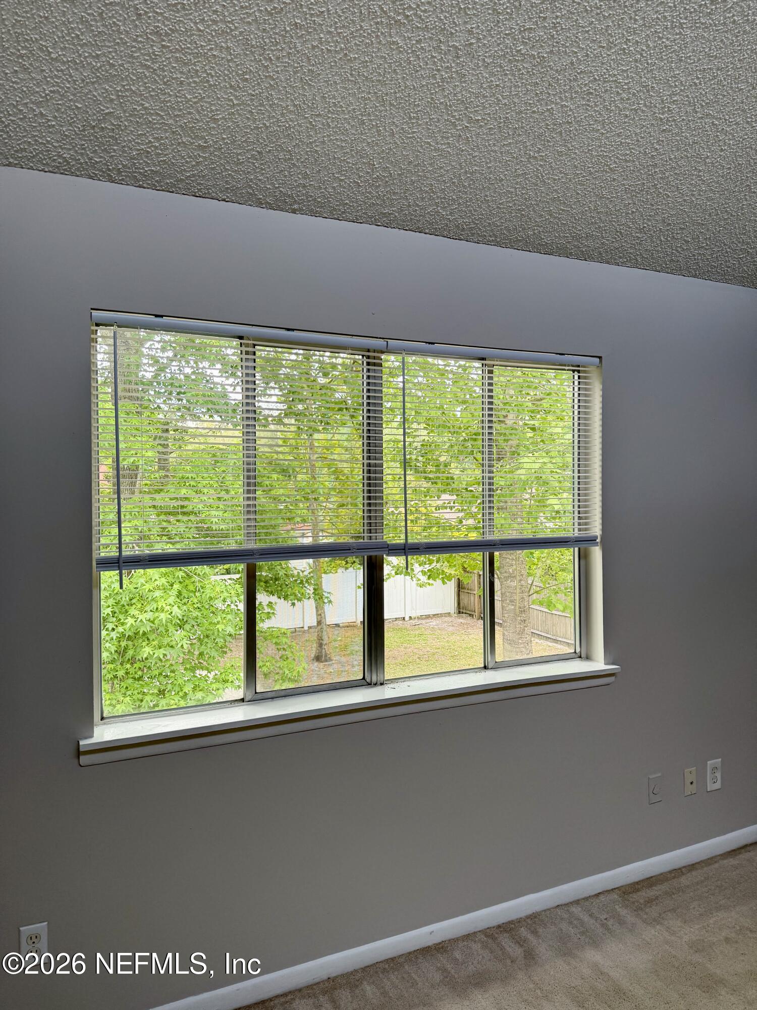11598 West Ride Drive Jacksonville, FL 32223 - Photo 9 of 15 a view of an empty room with a window