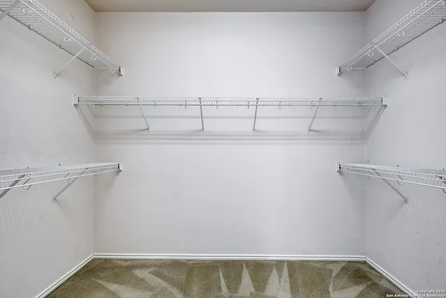 a view of a room with racks on the wall