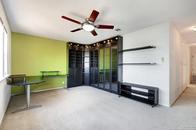 a view of workspace with furniture and window