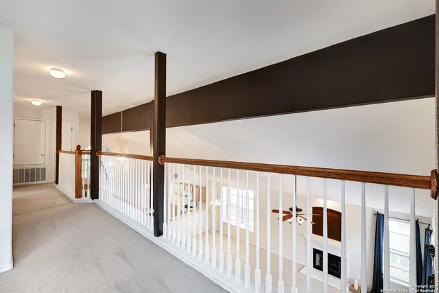 a view of staircase with white floor and black wooden floor