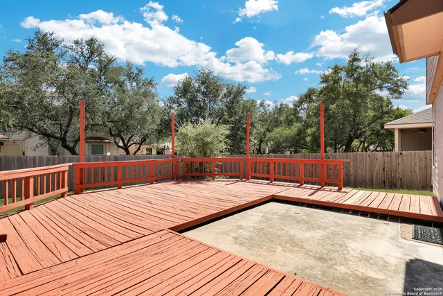 a view of a backyard with wooden floor