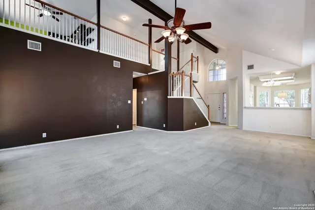 a view of a hallway with a livingroom