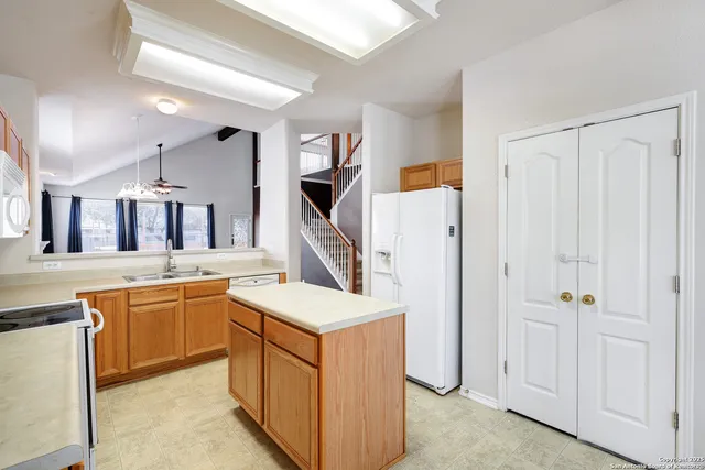 a kitchen with a sink and stove