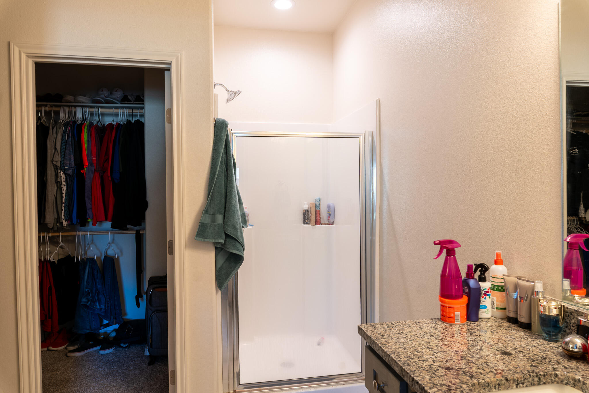 2625 136th Street Lubbock, TX 79423 - Photo 25 of 29 a view of walk in closet with clothes and shoes