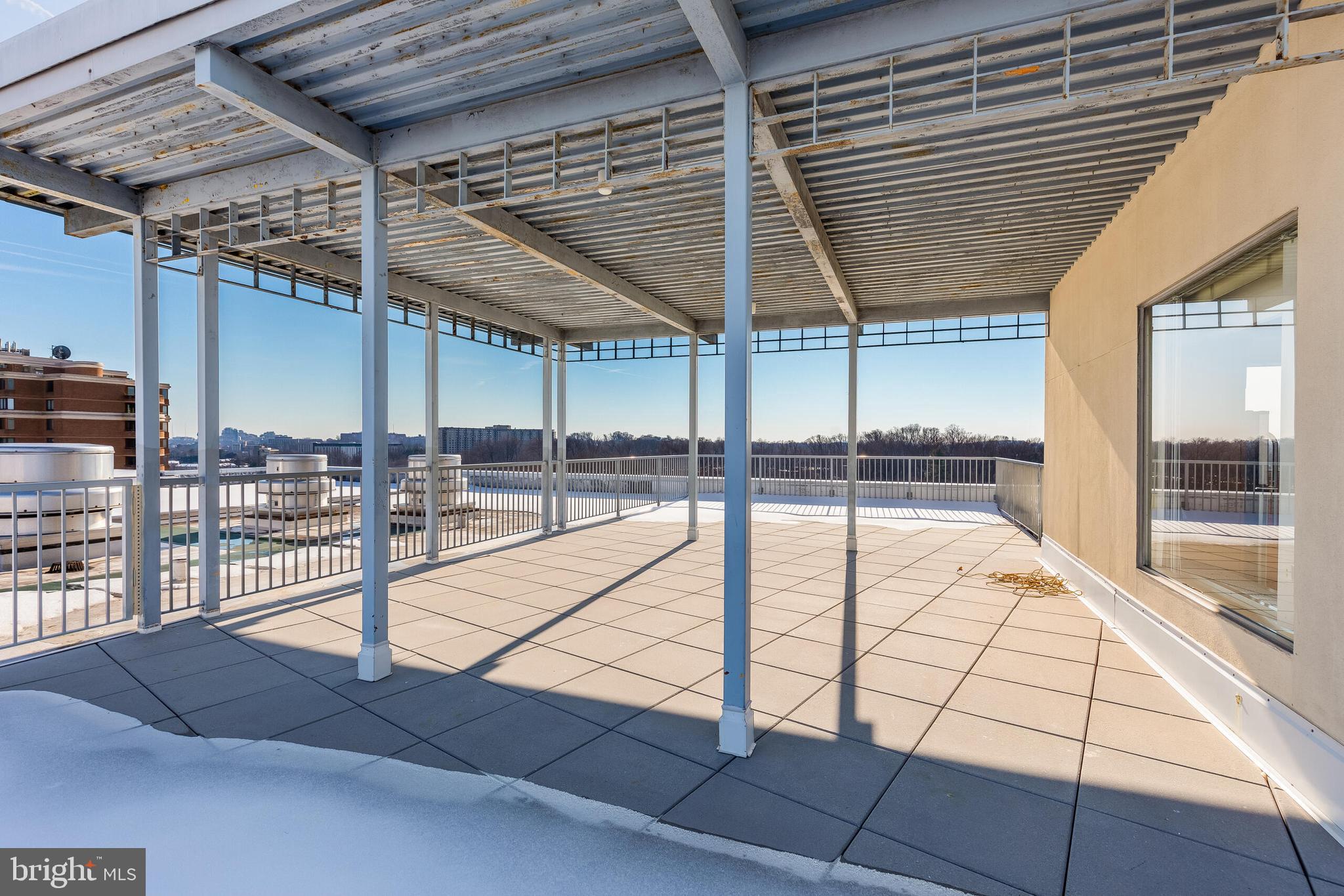10201 Grosvenor Place, Unit 204 Rockville, MD 20852 - Photo 23 of 25 a view of a swimming pool with a patio