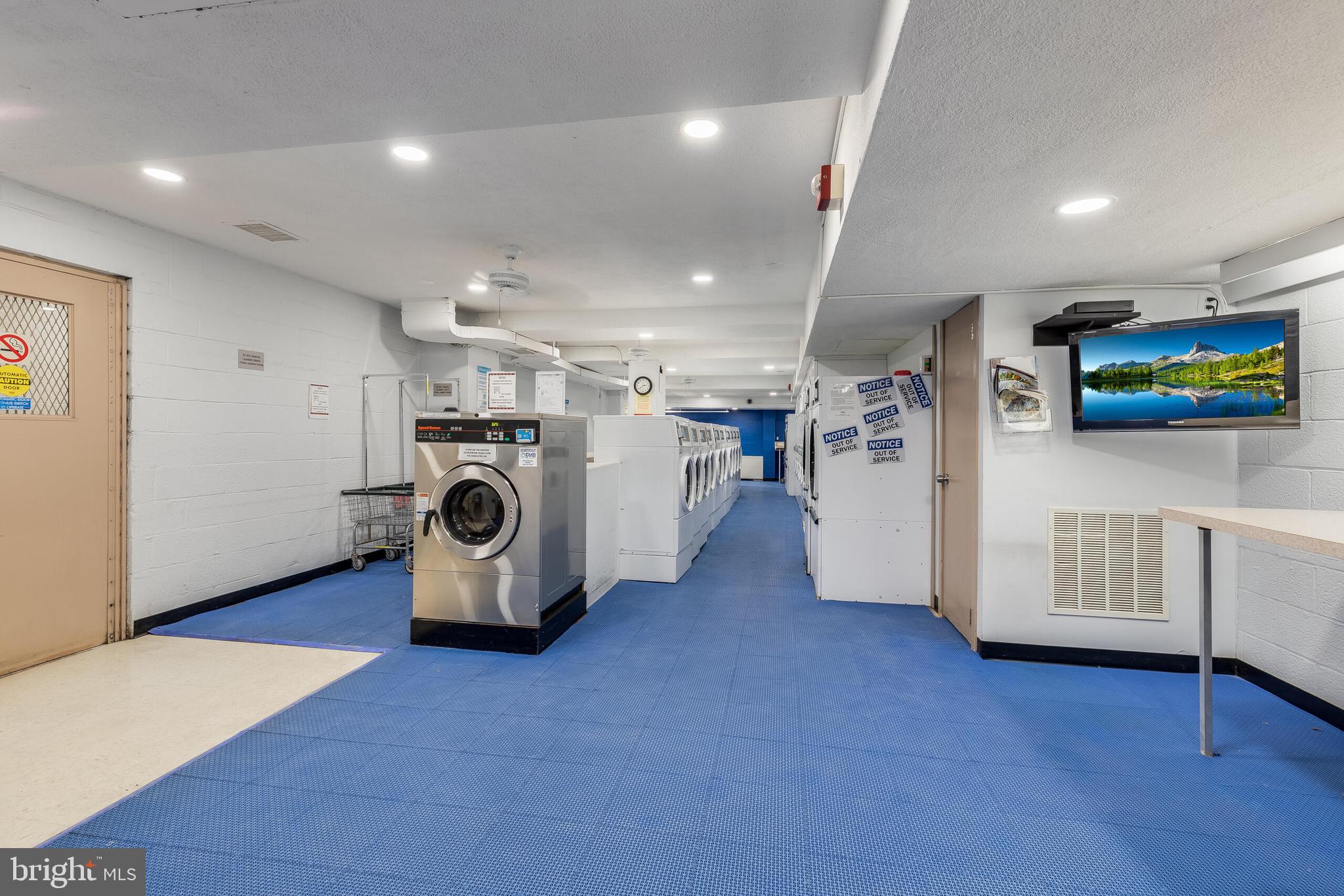 10201 Grosvenor Place, Unit 204 Rockville, MD 20852 - Photo 25 of 25 a view of livingroom with furniture and flat screen tv