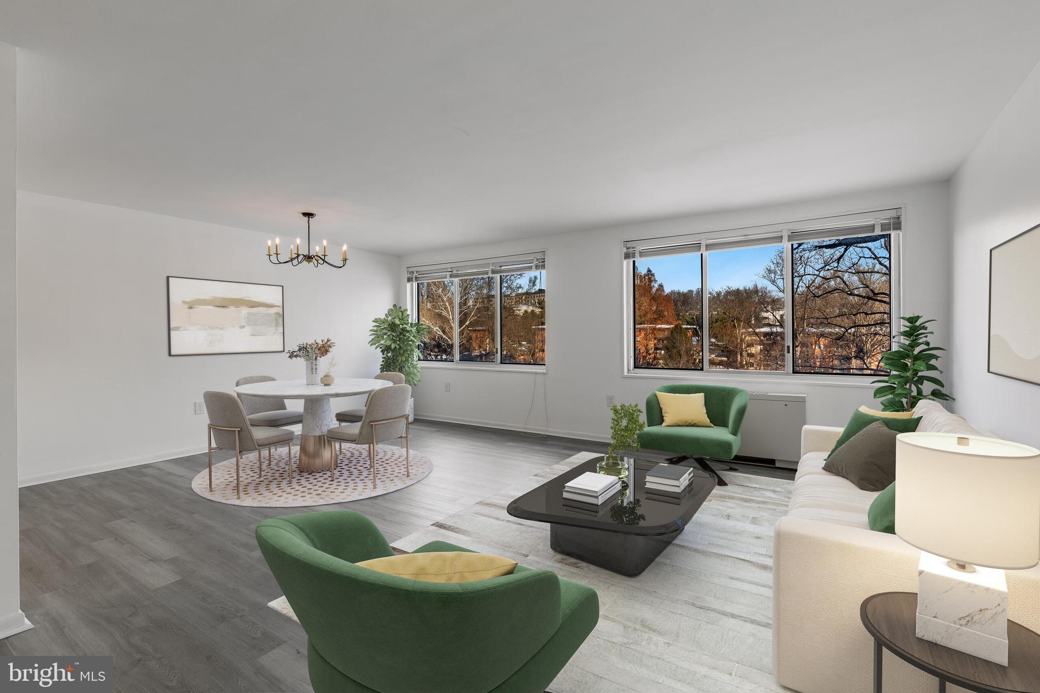 10201 Grosvenor Place, Unit 204 Rockville, MD 20852 - Photo 5 of 25 a living room with furniture and a large window