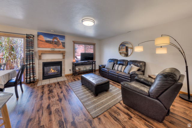 3461 Westwater Road, Unit 6 Moab, UT 84532 - Photo 8 of 33 Living room featuring wood finished floors and a tile fireplace