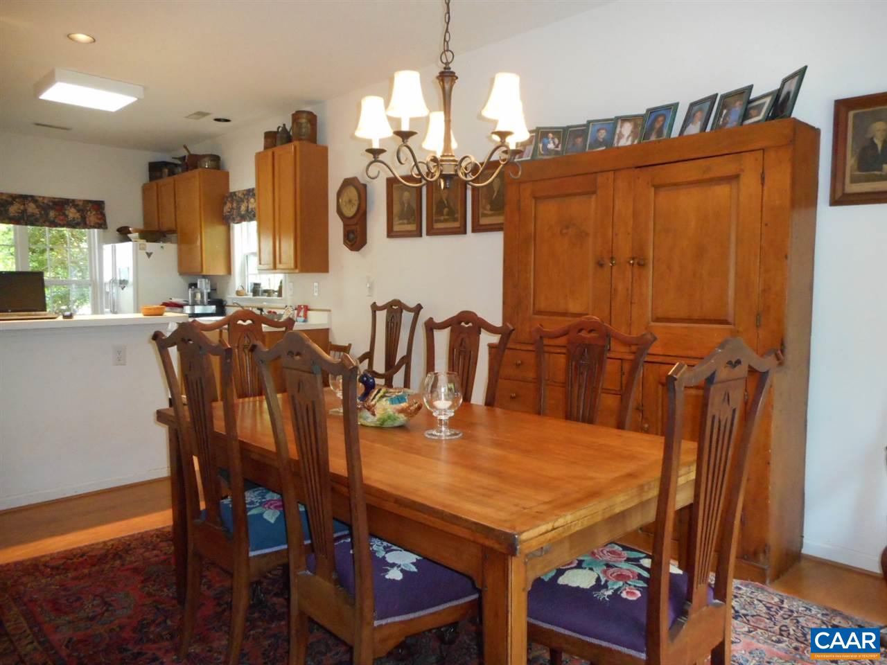 1233 Raintree Drive Charlottesville, VA 22901 - Photo 14 of 26 a view of a dining room with furniture and chandelier