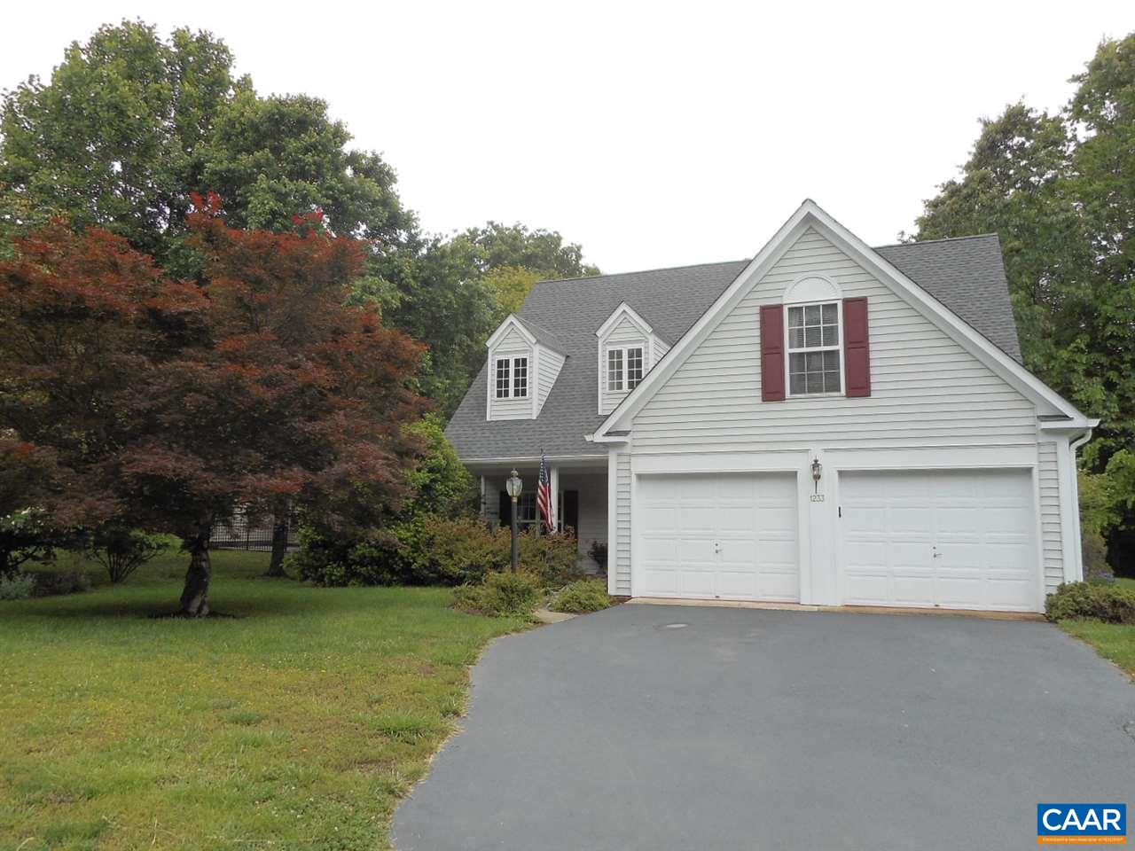 1233 Raintree Drive Charlottesville, VA 22901 - Photo 2 of 26 a view of a white house next to a yard with big trees