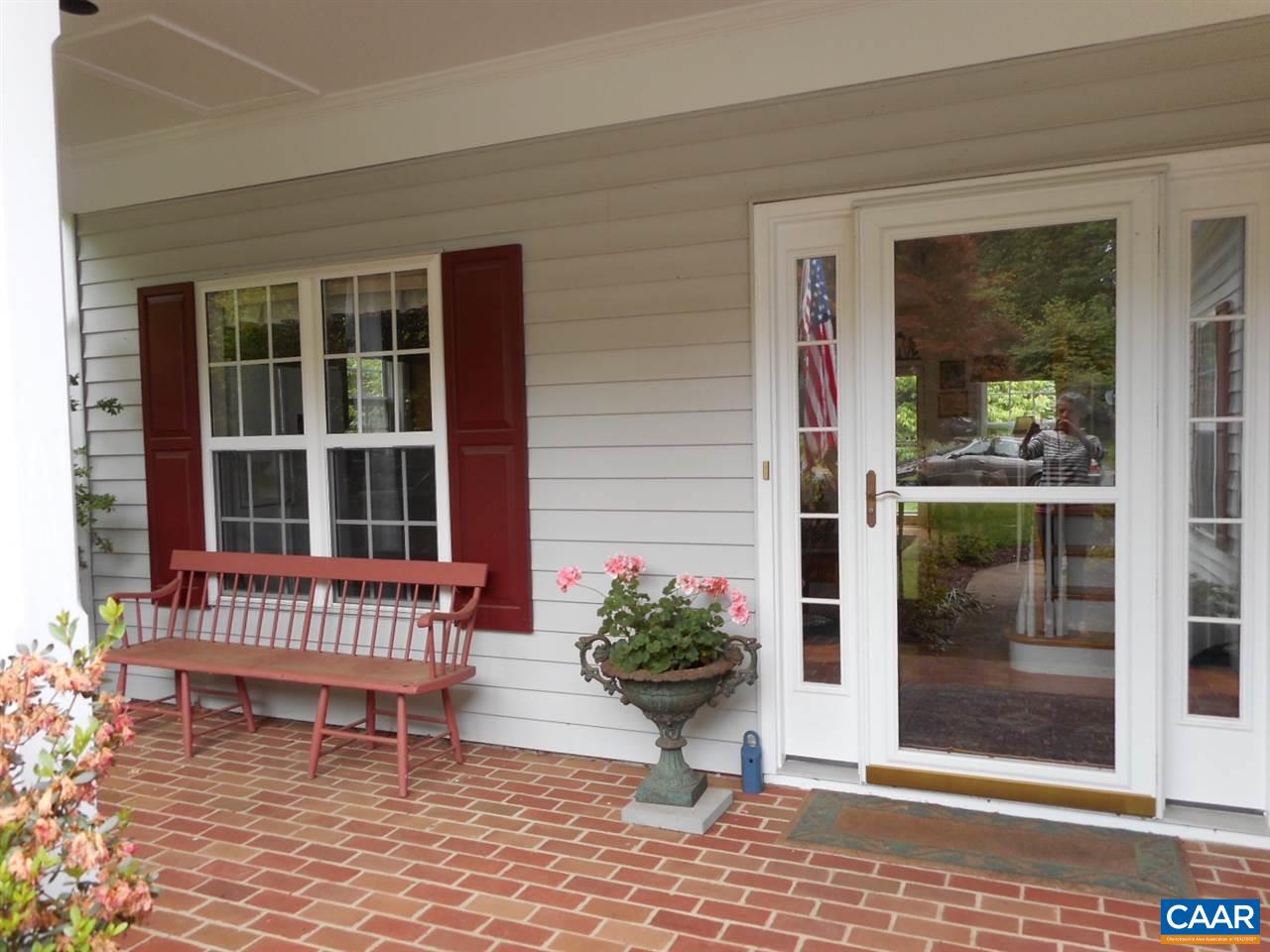 1233 Raintree Drive Charlottesville, VA 22901 - Photo 4 of 26 a view of a house with a porch