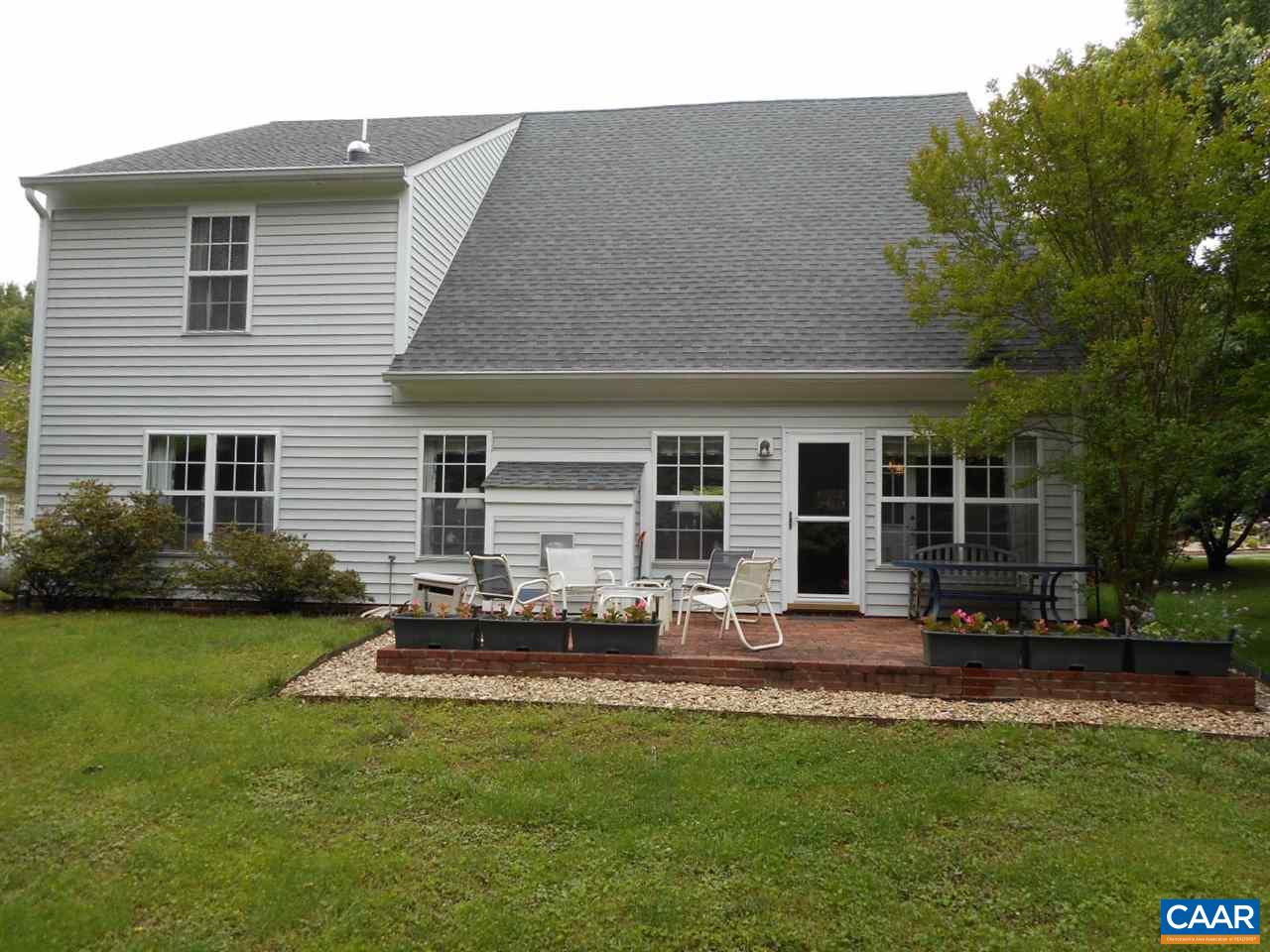 1233 Raintree Drive Charlottesville, VA 22901 - Photo 5 of 26 a backyard of a house with table and chairs