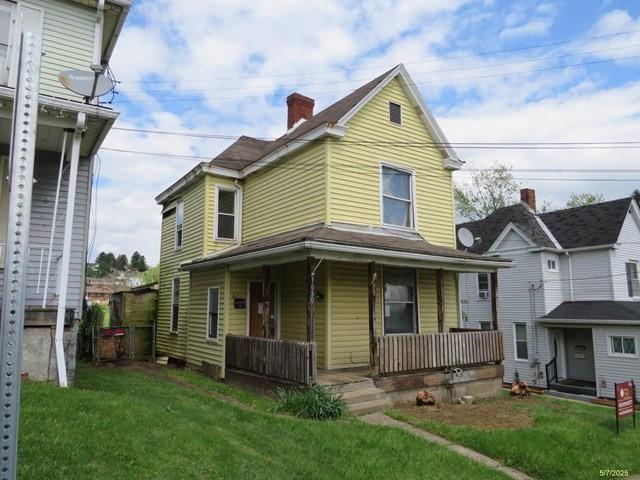1080 Bruce Street Washington, PA 15301 - Photo 3 of 17 a front view of a house with a yard