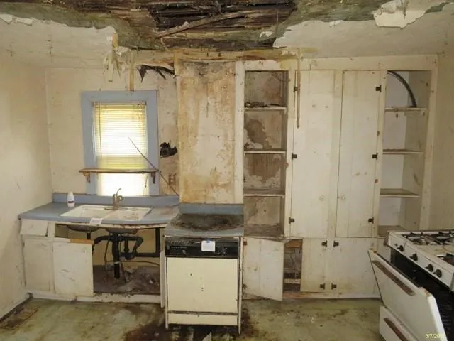 a room with a stove and a table