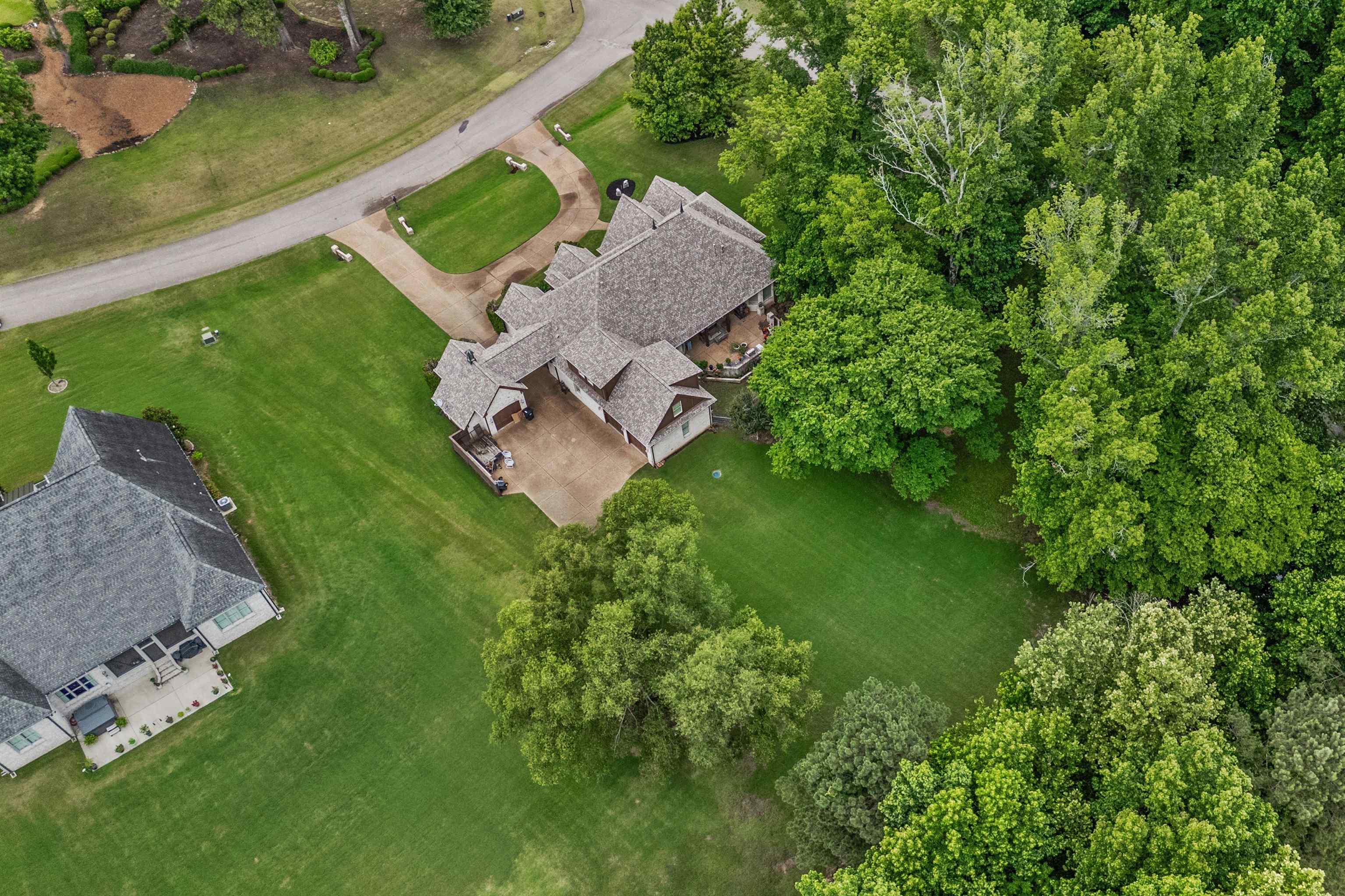 150 Ridgecrest Drive Arlington, TN 38002 - Photo 38 of 40 Expansive residential property featuring a multi-gabled roofline and an extensive lawn with mature trees