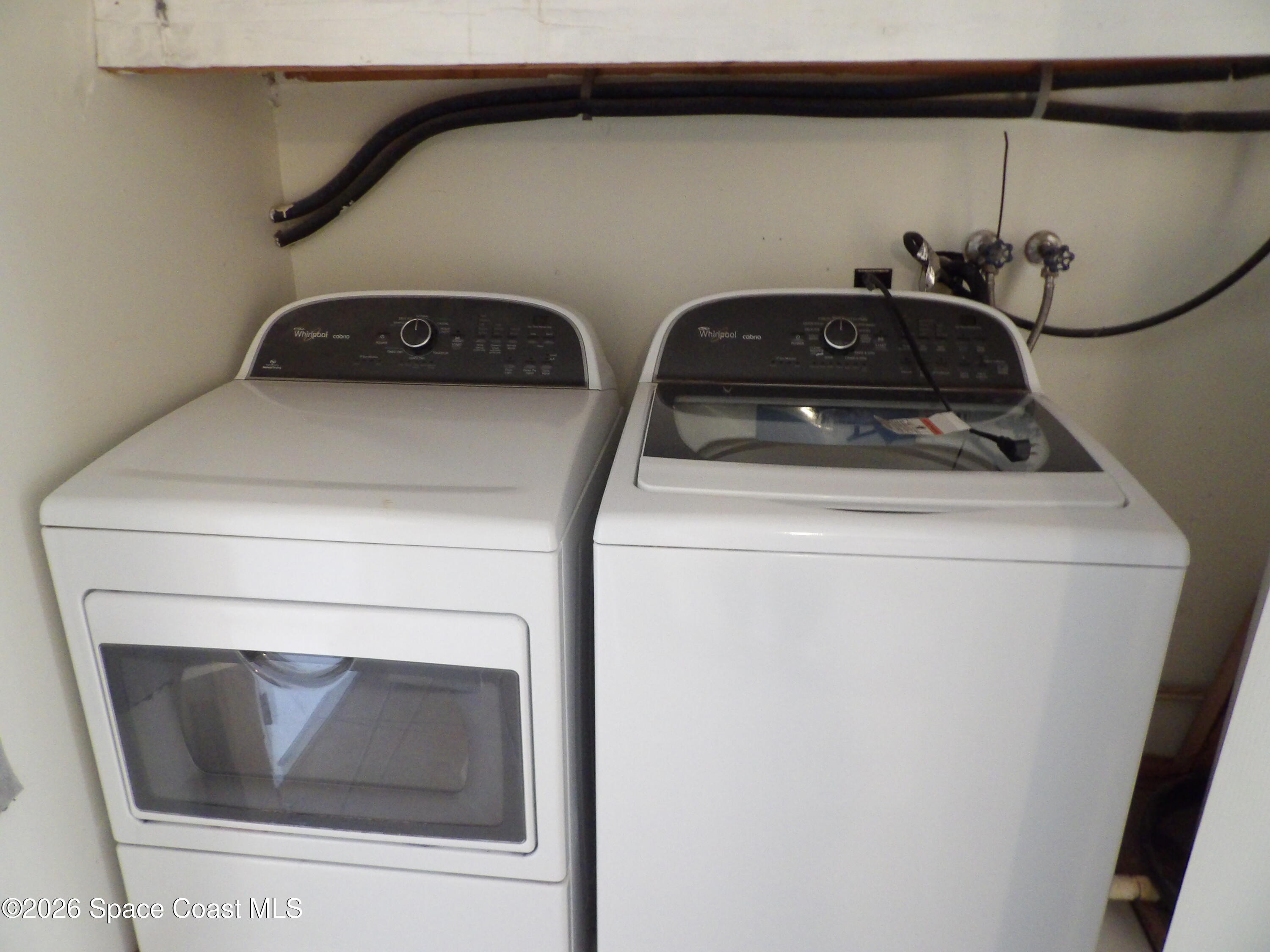 6318 Hudson Road Cocoa, FL 32927 - Photo 13 of 38 a utility room with dryer and washer