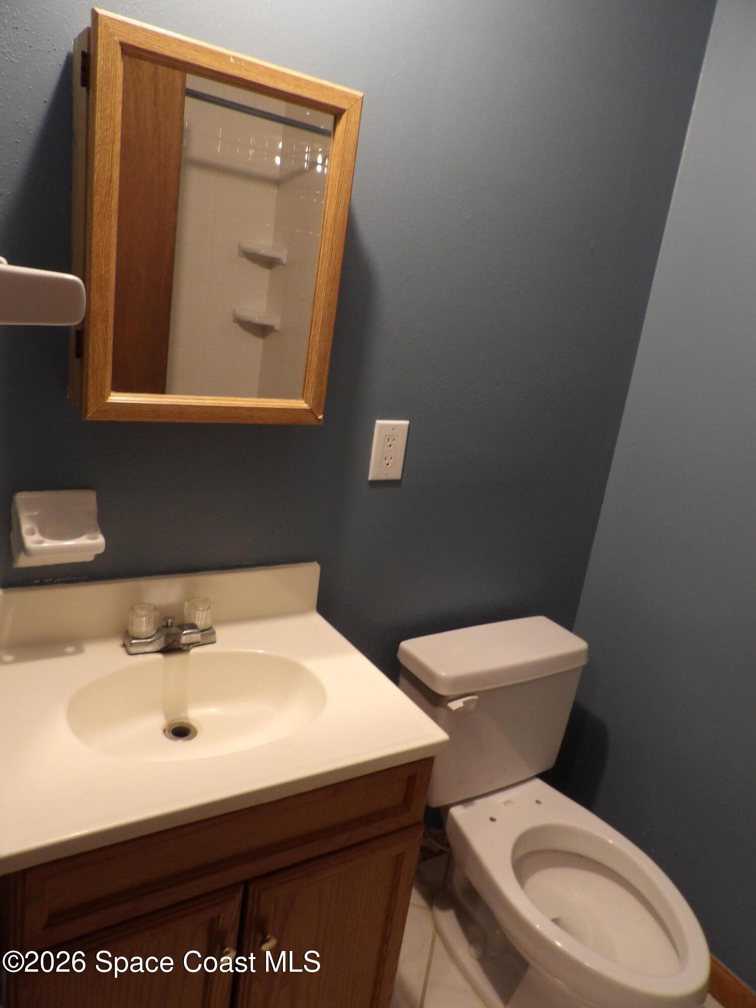 6318 Hudson Road Cocoa, FL 32927 - Photo 21 of 38 a bathroom with a sink mirror and toilet