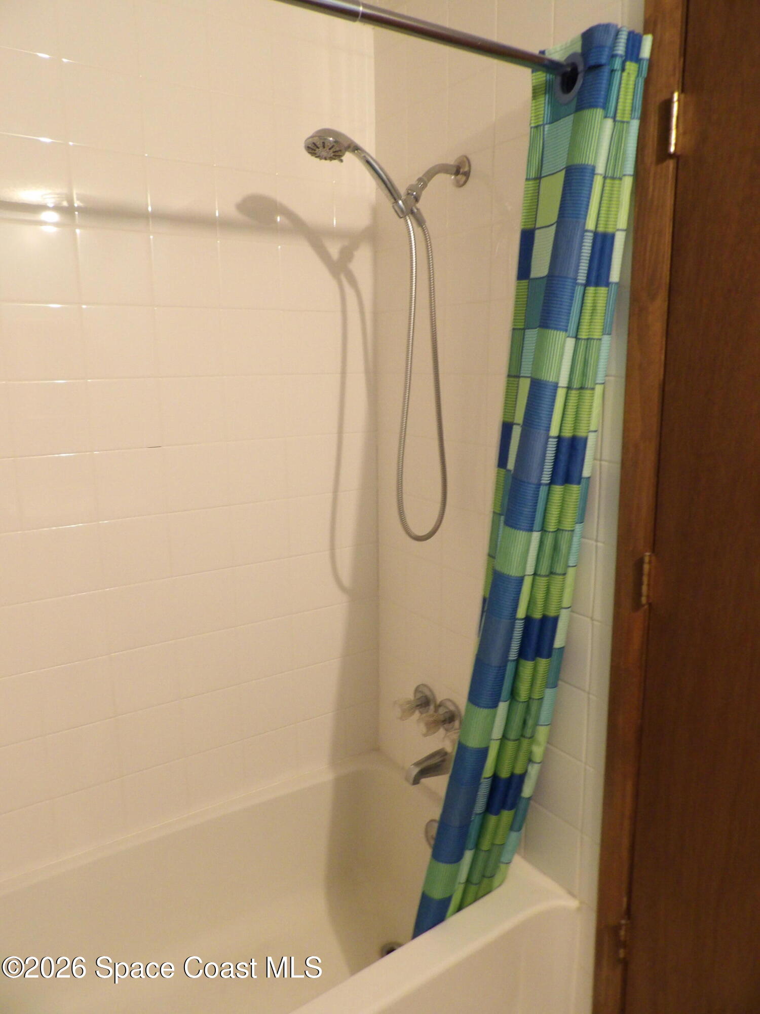 6318 Hudson Road Cocoa, FL 32927 - Photo 22 of 38 a bathroom with a shower and a shower head
