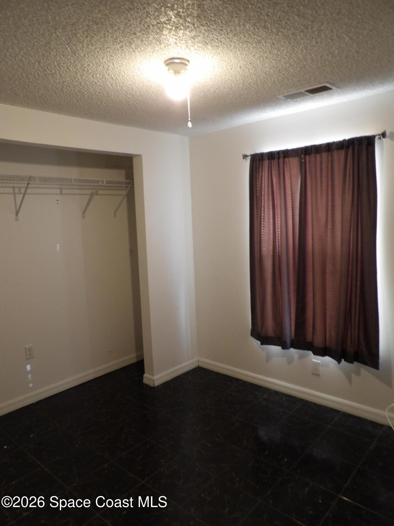 6318 Hudson Road Cocoa, FL 32927 - Photo 23 of 38 an empty room with a wooden door