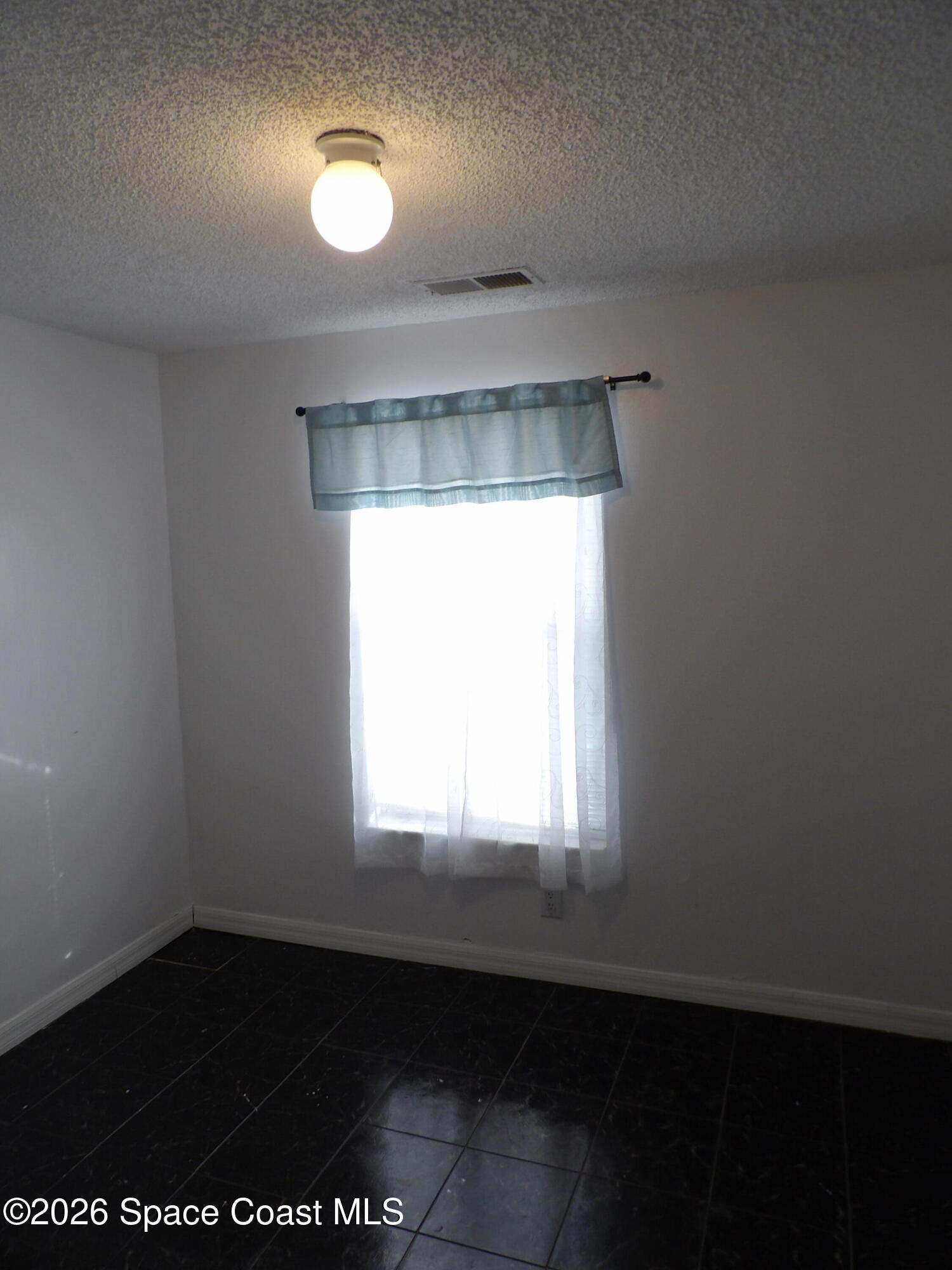 6318 Hudson Road Cocoa, FL 32927 - Photo 24 of 38 a view of an empty room with a window