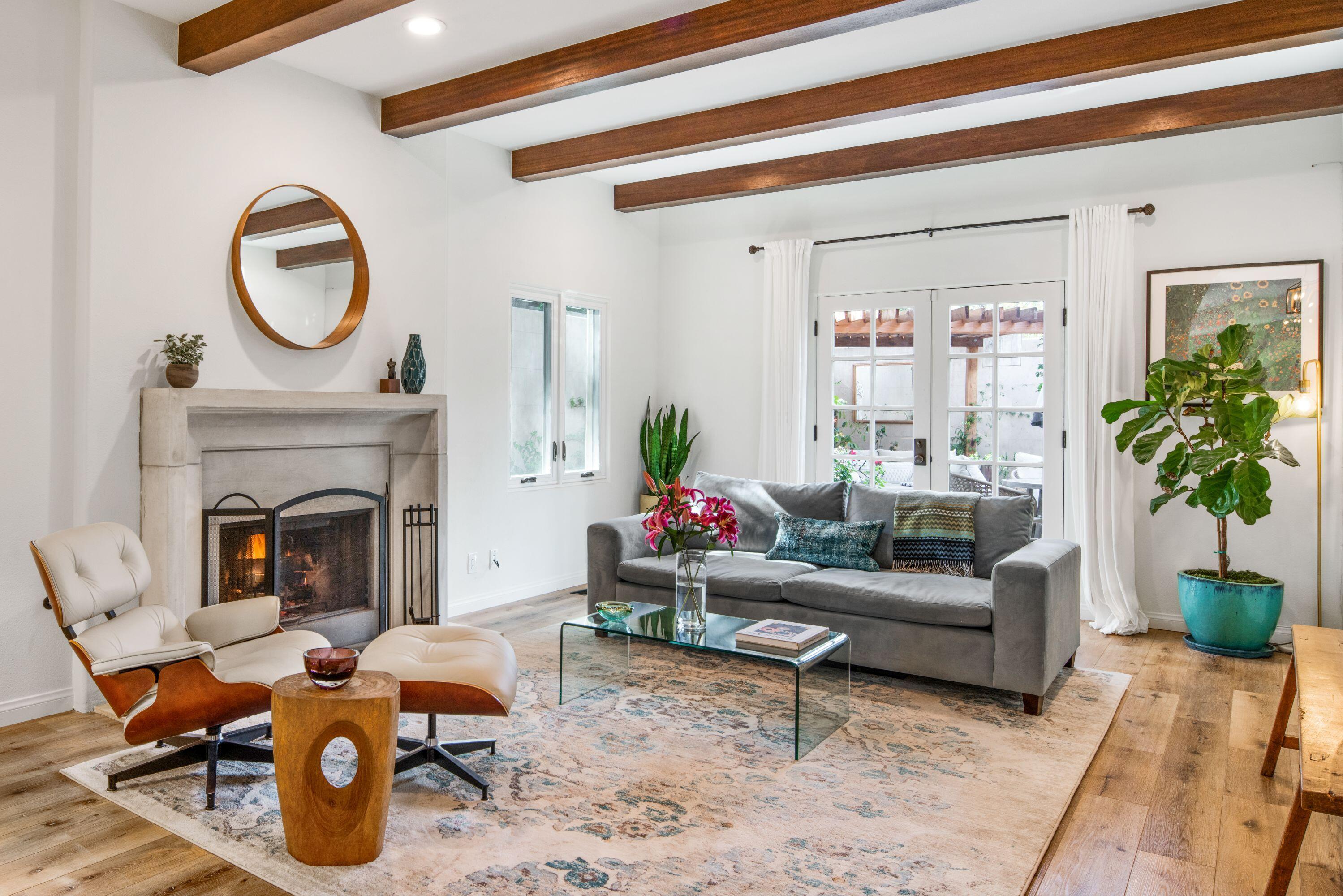 81 Depot Road Santa Barbara, CA 93108 - Photo 5 of 21 a living room with furniture a fireplace and potted plants