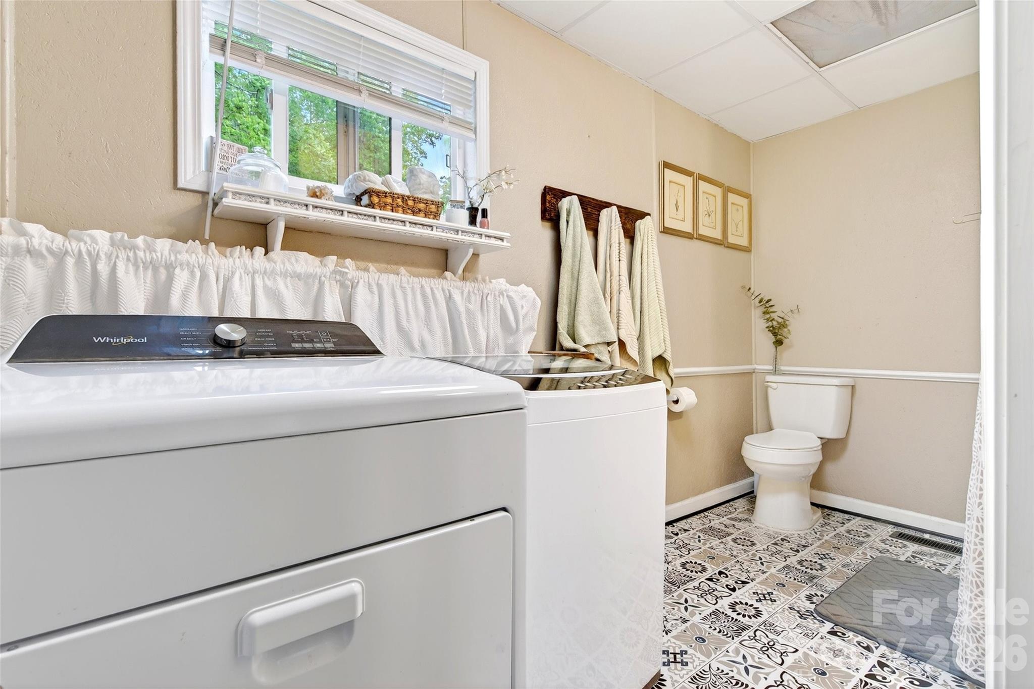 227 Locust Cove Road Marion, NC 28752 - Photo 28 of 34 a bathroom with a granite countertop sink toilet and mirror