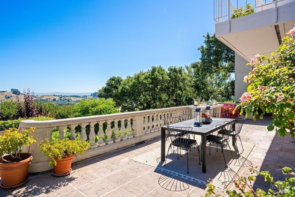 82 McNear Drive San Rafael, CA 94901 - Photo 22 of 54 a balcony with wooden floor and outdoor seating