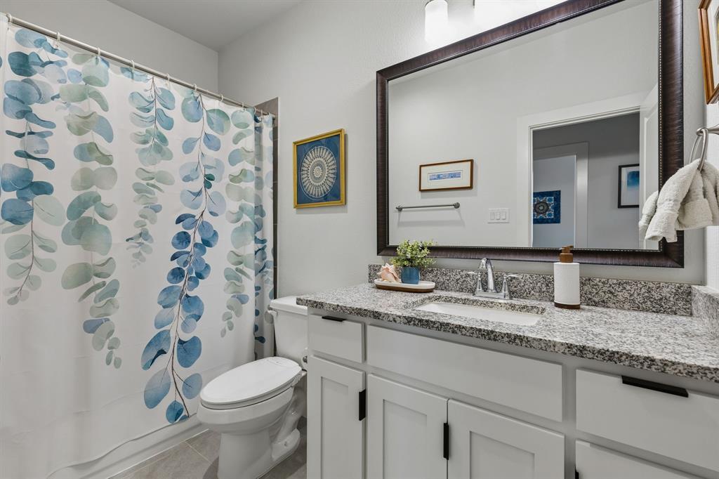 6527 Bowman Roberts Road Fort Worth, TX 76179 - Photo 21 of 27 Full Bathroom Showcasing Granite Countertops And Designer Framed Mirror