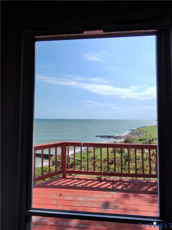 36 Beach Road Reedville, VA 22539 - Photo 34 of 35 Expansive outdoor deck with a wooden railing and w