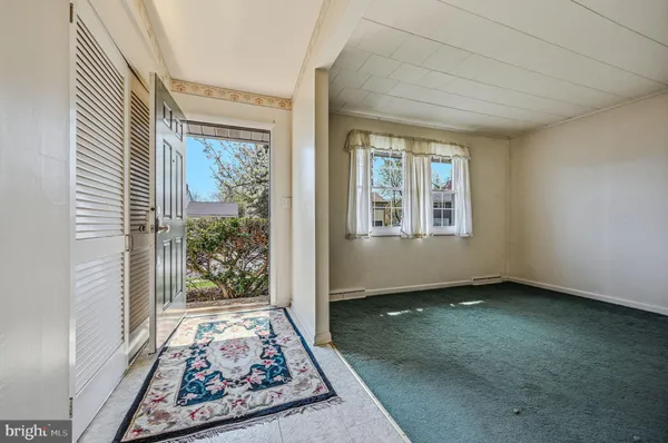an entryway with a rug