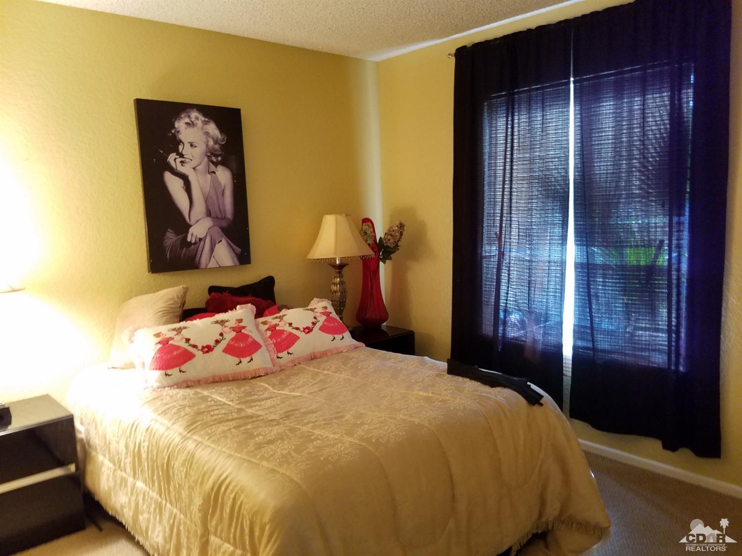 3166 Tomahawk Circle Riverside, CA 92503 - Photo 16 of 29 a bedroom with a bed and a painting on the wall