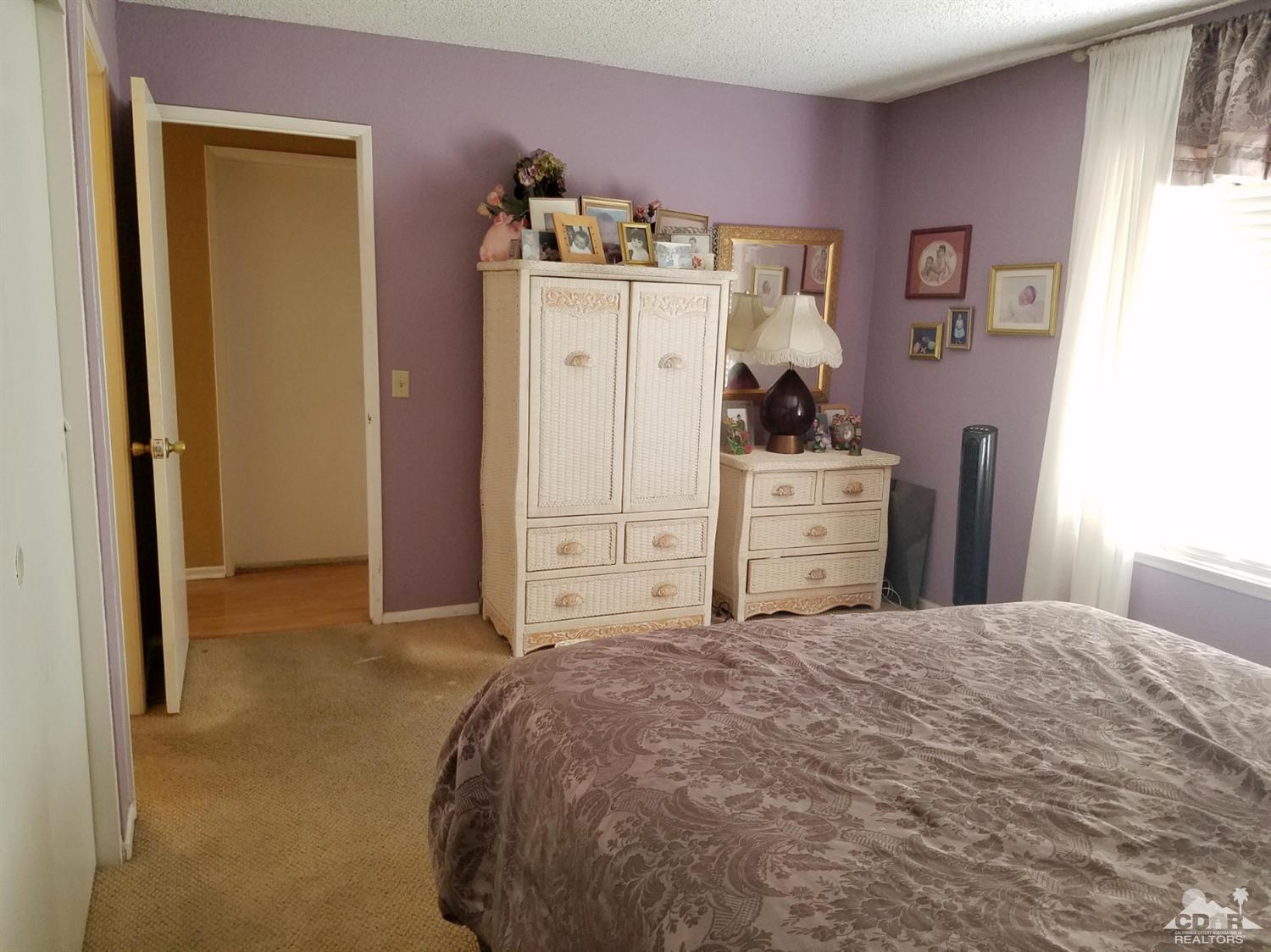 3166 Tomahawk Circle Riverside, CA 92503 - Photo 21 of 29 a bedroom with a bed and a closet