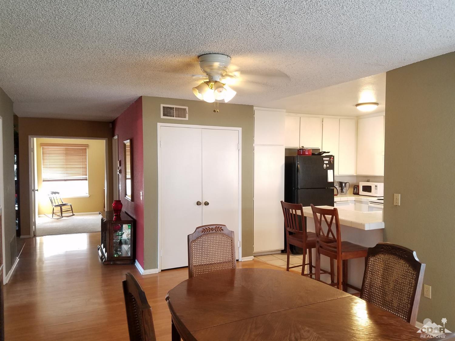3166 Tomahawk Circle Riverside, CA 92503 - Photo 25 of 29 a view of a dining room with furniture and wooden floor