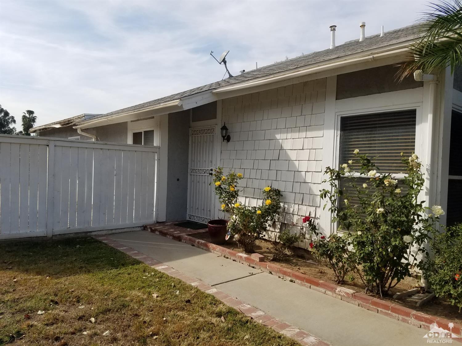 3166 Tomahawk Circle Riverside, CA 92503 - Photo 29 of 29 a backyard of a house with flower plants