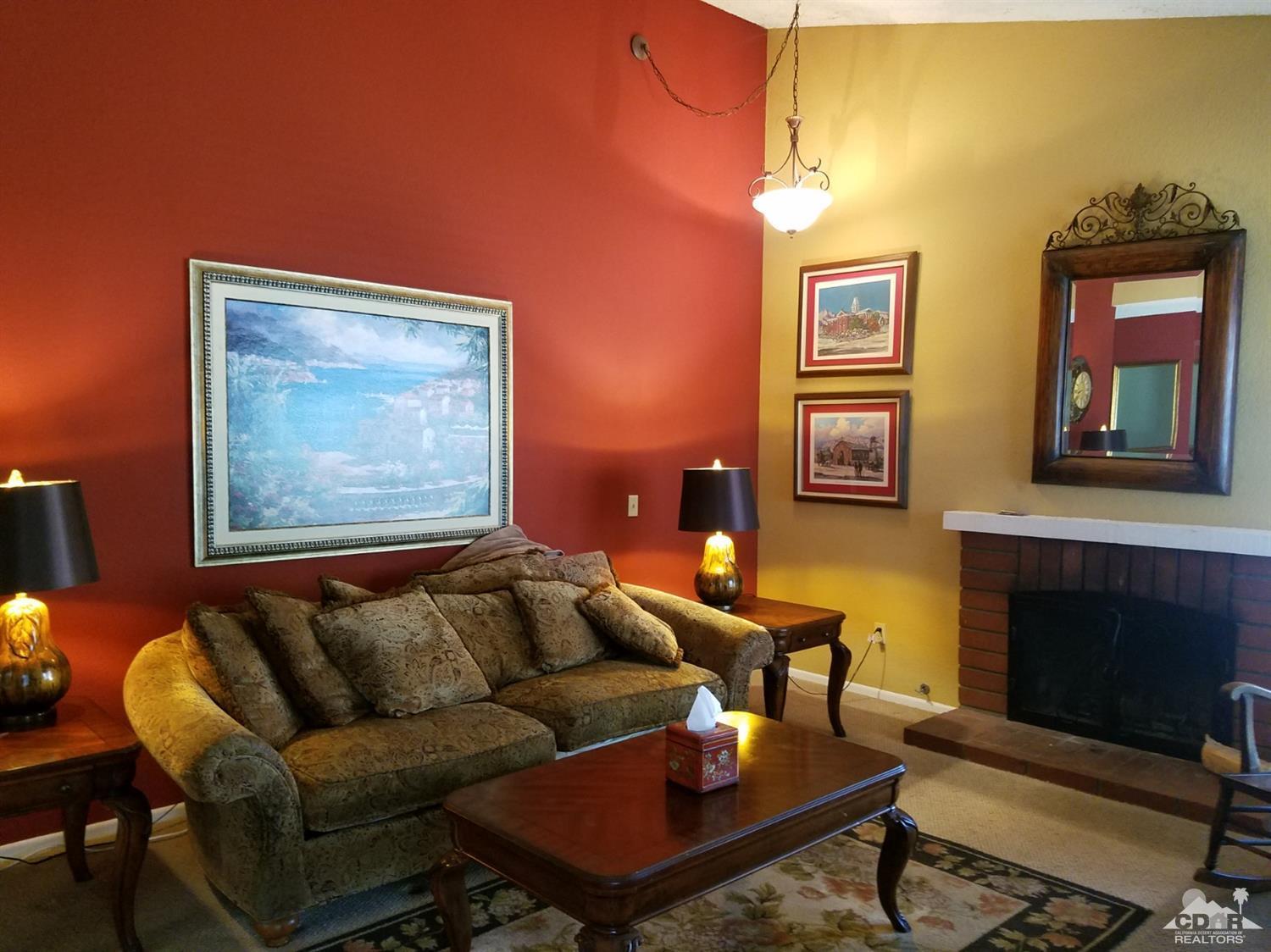 3166 Tomahawk Circle Riverside, CA 92503 - Photo 6 of 29 a living room with furniture a rug and a fireplace