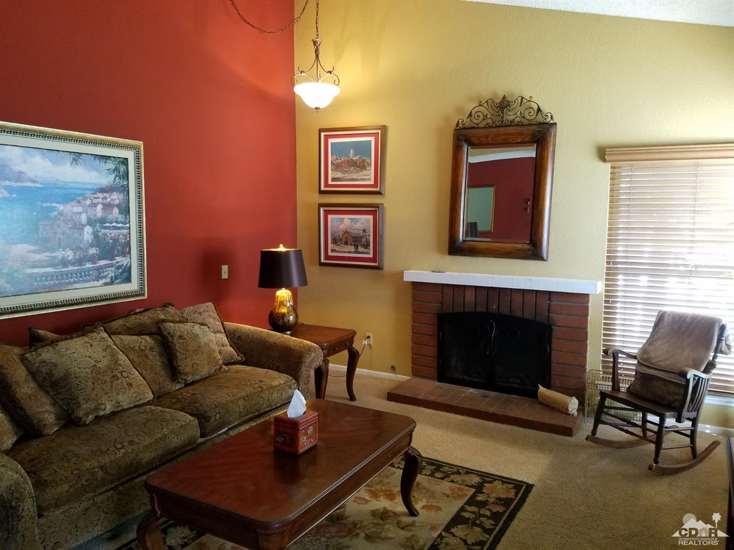 3166 Tomahawk Circle Riverside, CA 92503 - Photo 7 of 29 a living room with furniture a flat screen tv and a fireplace