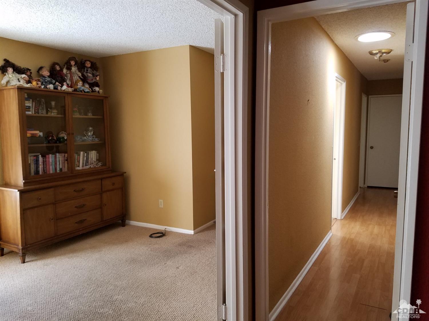 3166 Tomahawk Circle Riverside, CA 92503 - Photo 10 of 29 a view of a hallway to room with wooden floor