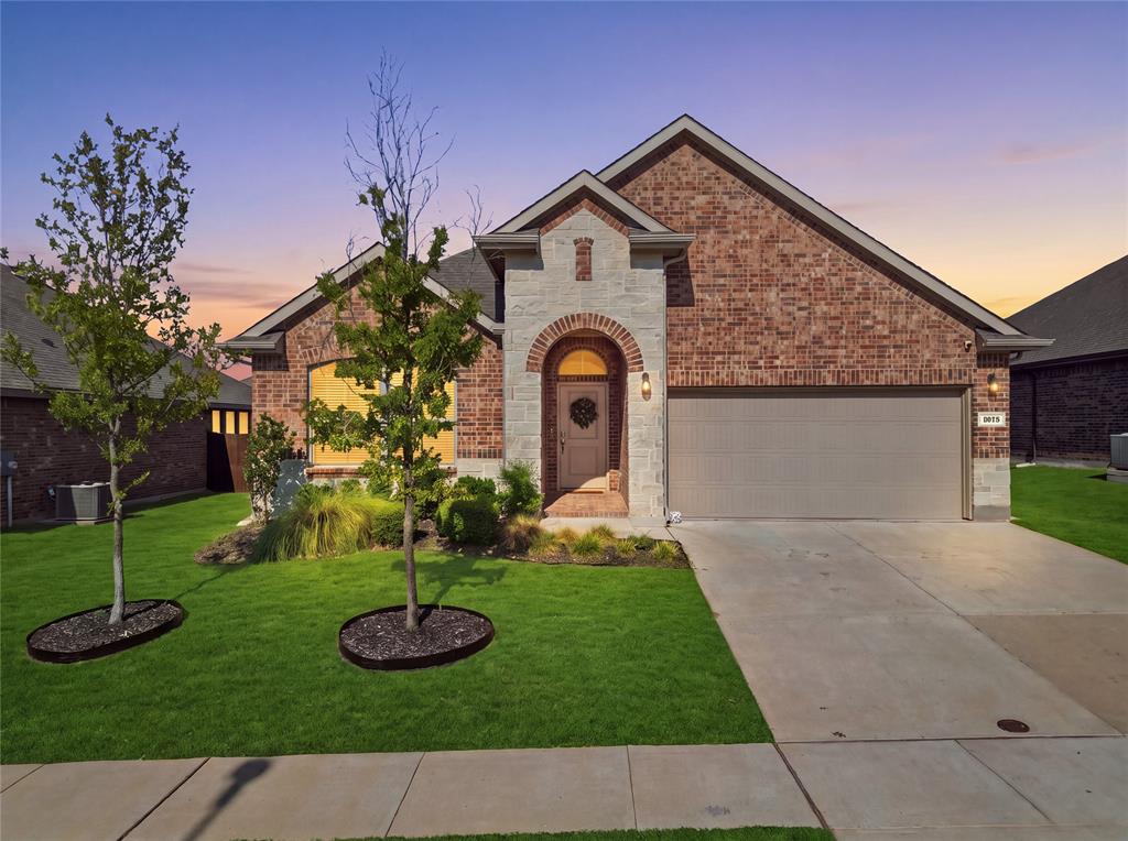 1812 Ruffian Road Granbury, TX 76049 - Photo 1 of 37 Brick exterior with arched entryway and decorative trim accents the front elevation of this single-story home