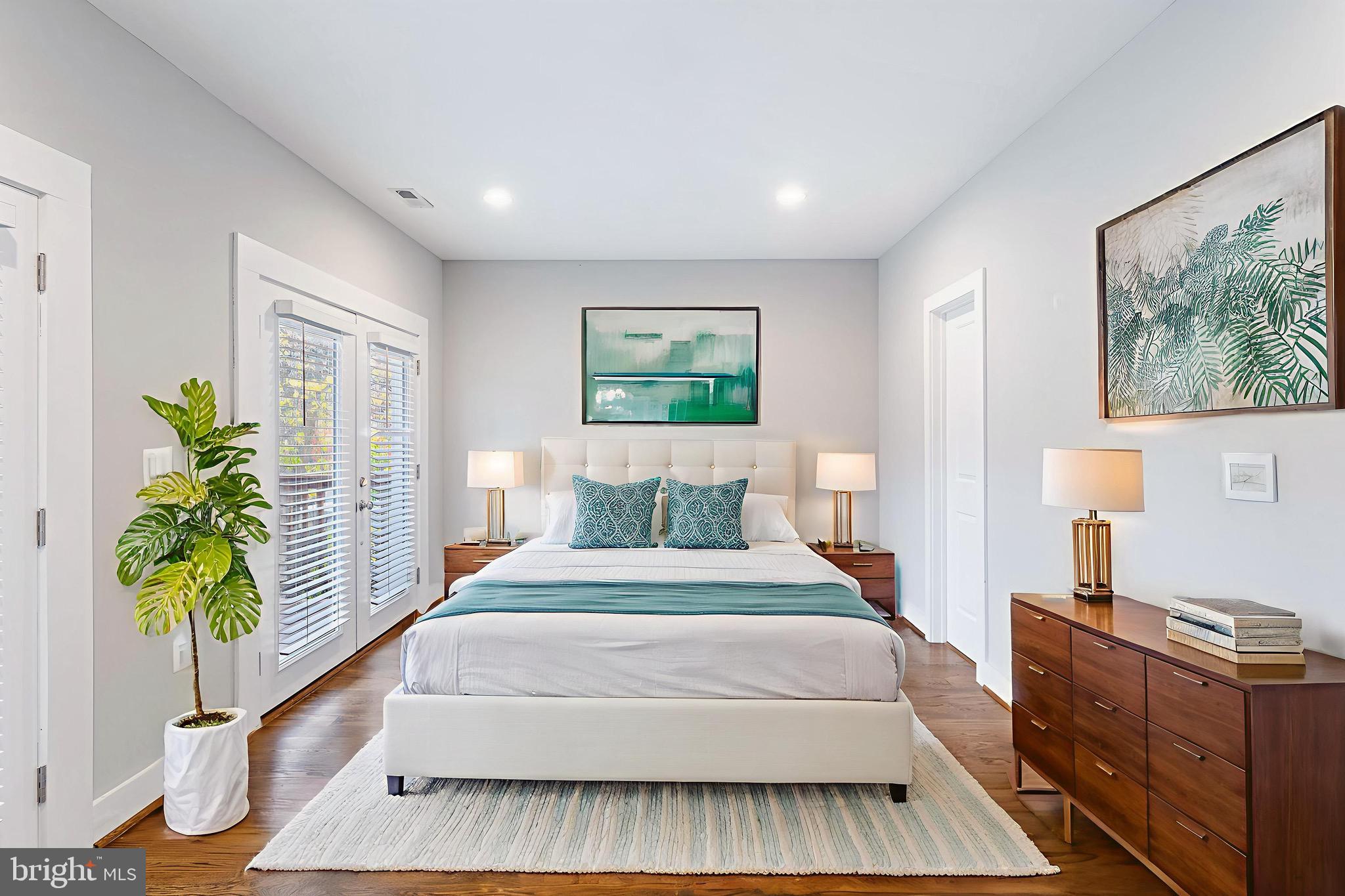 1221 Kenyon Street Northwest, Unit 2 Washington, DC 20010 - Photo 8 of 26 a spacious bedroom with a large bed and a window
