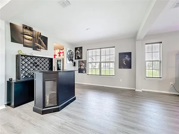 an aerial view of residential houses with outdoor space and lake view