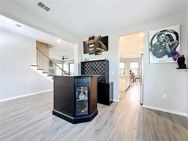 an aerial view of a house with a swimming pool a patio and ocean view