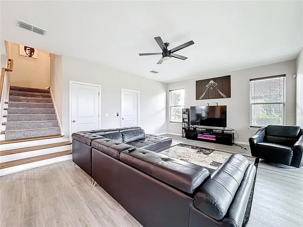 a bathroom with a granite countertop sink mirror and bathtub