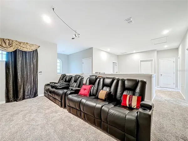 a living room with a couch and a flat screen tv