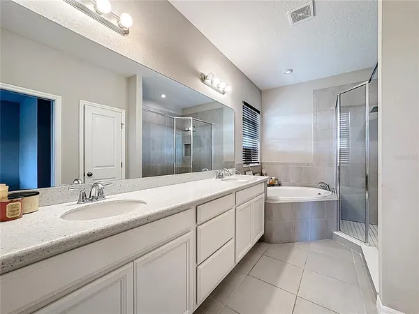 a bathroom with a toilet a sink and a mirror