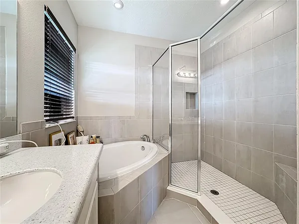 a living room with furniture and floor to ceiling window