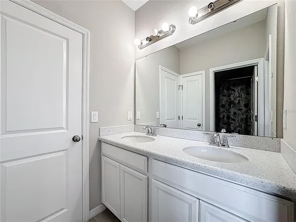 an aerial view of a house with a lake view