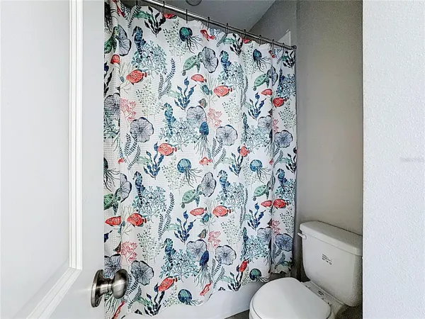 an aerial view of a house with a lake view