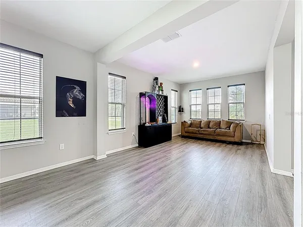 a kitchen with stainless steel appliances kitchen island granite countertop a refrigerator and a stove top oven