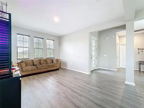 a kitchen with white cabinets a sink and dishwasher